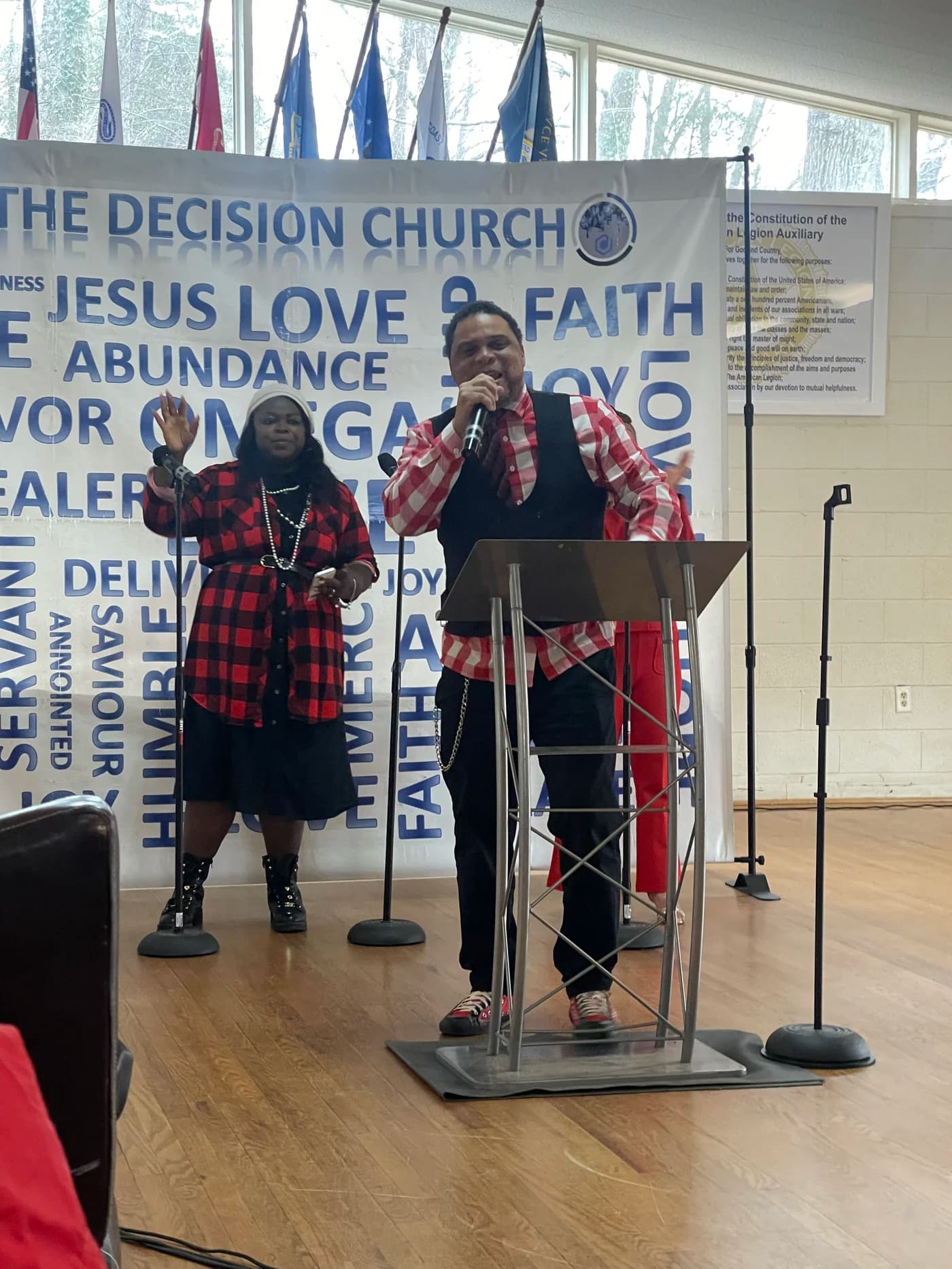 Teaching during a worship gathering at The Decision Christian Assembly